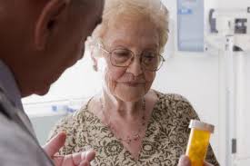 Added value as independent pharmacist helps older patient understand medication and how to take the medicine. 